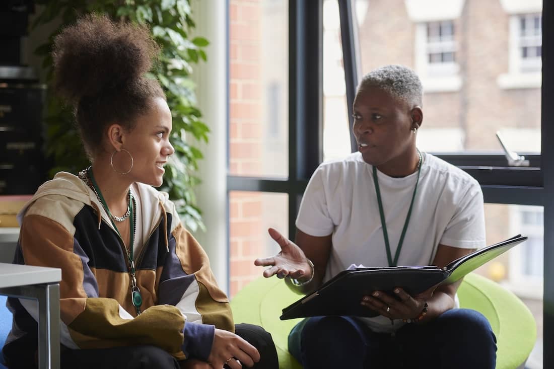 Professor speaking to a student.